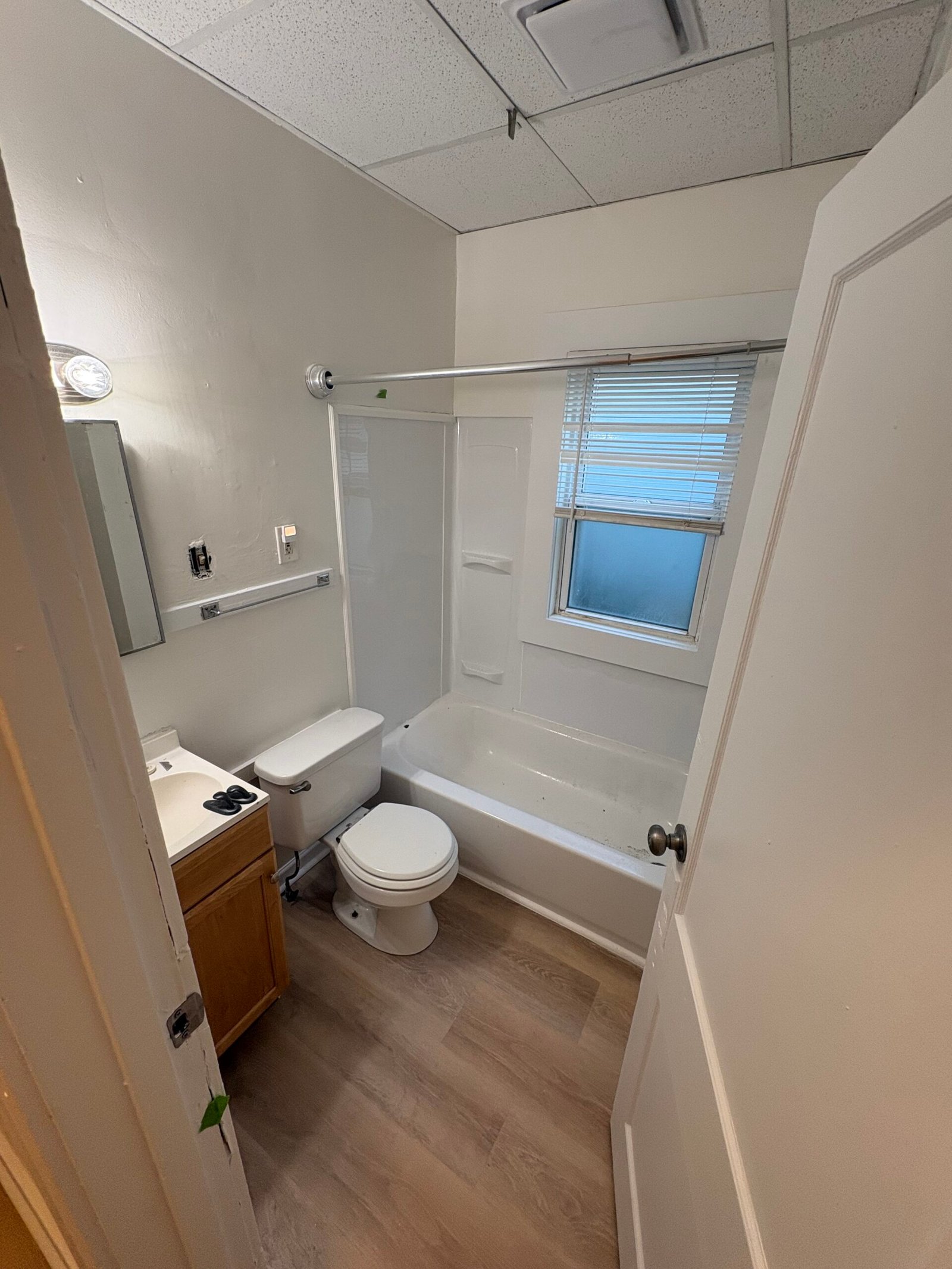 New Flooring, Shower Walls, Ceiling Tiles, and Bathroom Fan